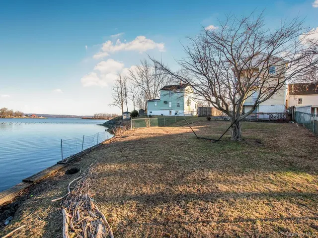 a view of a lake with a building in the background