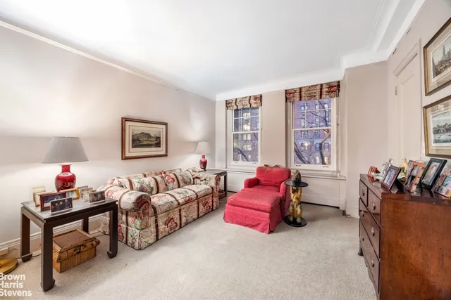 a bedroom with a large bed and a large window