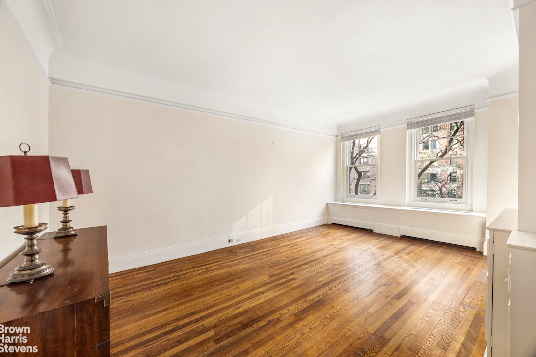 1075 Park Avenue, Unit 3D Manhattan, NY 10128 - Photo 13 of 20 a view of room with hardwood floor and window