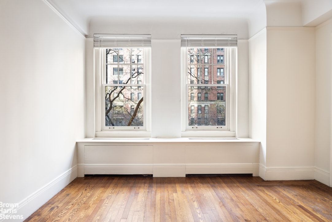 1075 Park Avenue, Unit 3D Manhattan, NY 10128 - Photo 14 of 20 a view of a small space with wooden floor and a window