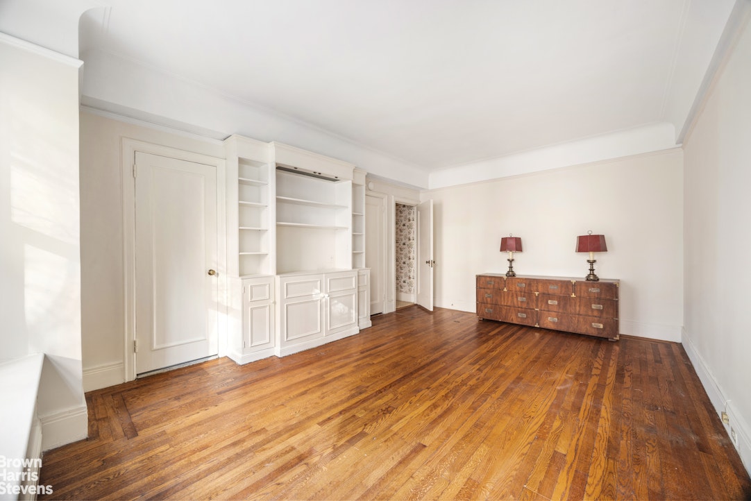 1075 Park Avenue, Unit 3D Manhattan, NY 10128 - Photo 15 of 20 a view of empty room with wooden floor