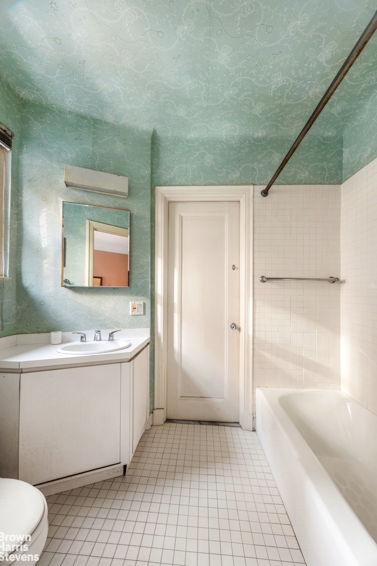 1075 Park Avenue, Unit 3D Manhattan, NY 10128 - Photo 18 of 20 a bathroom with a sink a toilet and shower