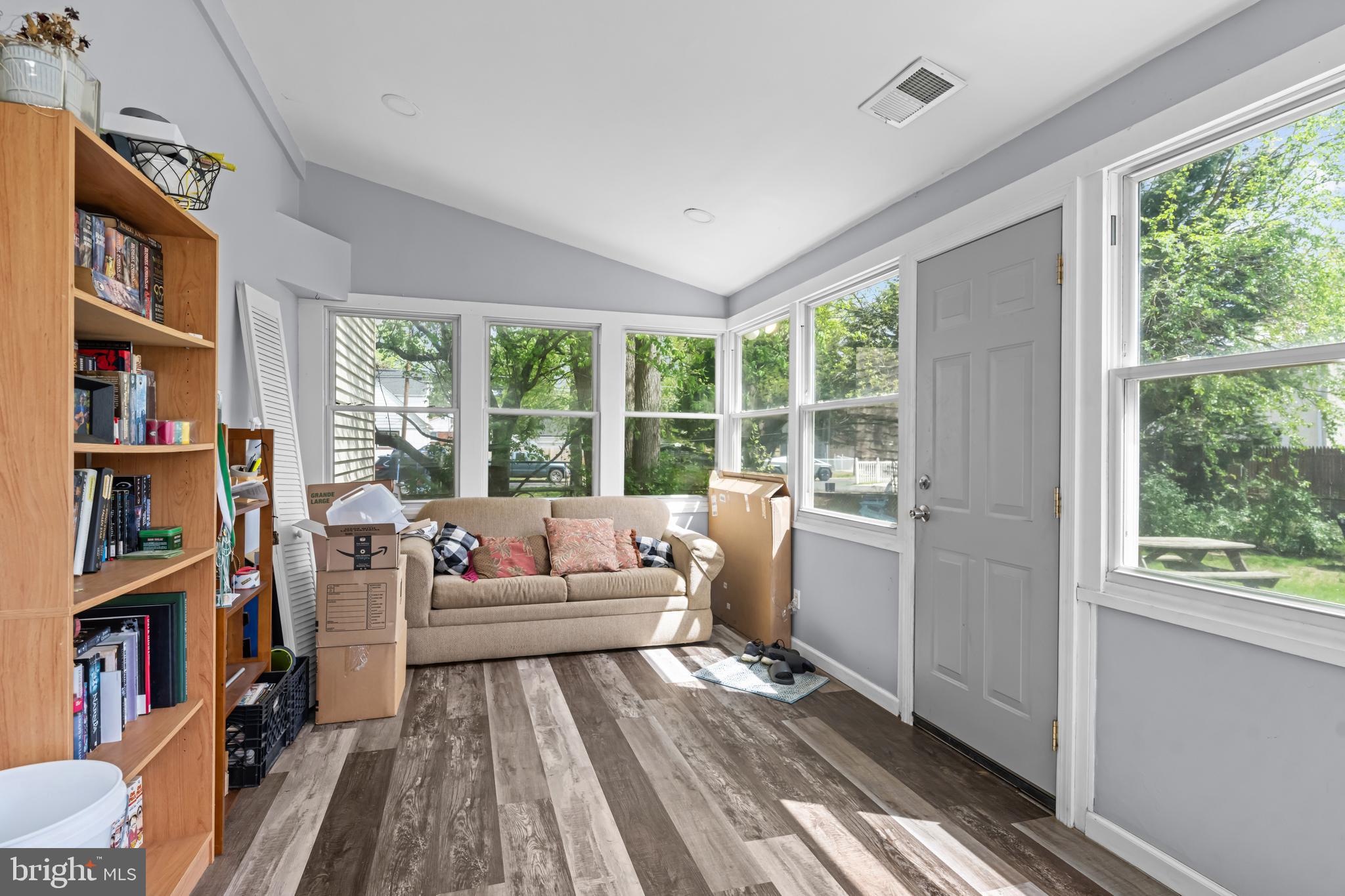 205 Nicholson Road Mount Ephraim, NJ 08059 - Photo 14 of 24 a living room with furniture a rug and a book shelf