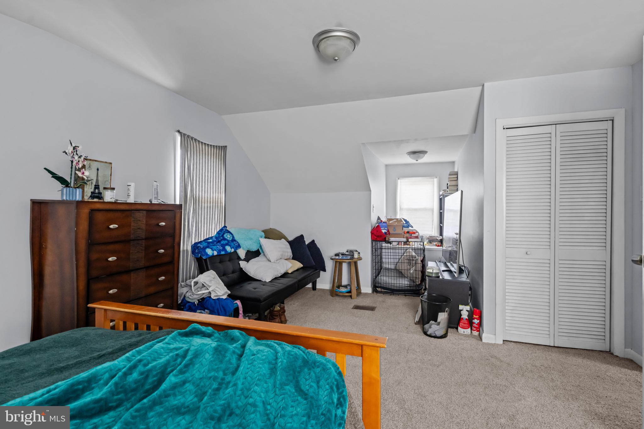 205 Nicholson Road Mount Ephraim, NJ 08059 - Photo 18 of 24 a living room with furniture and a chandelier