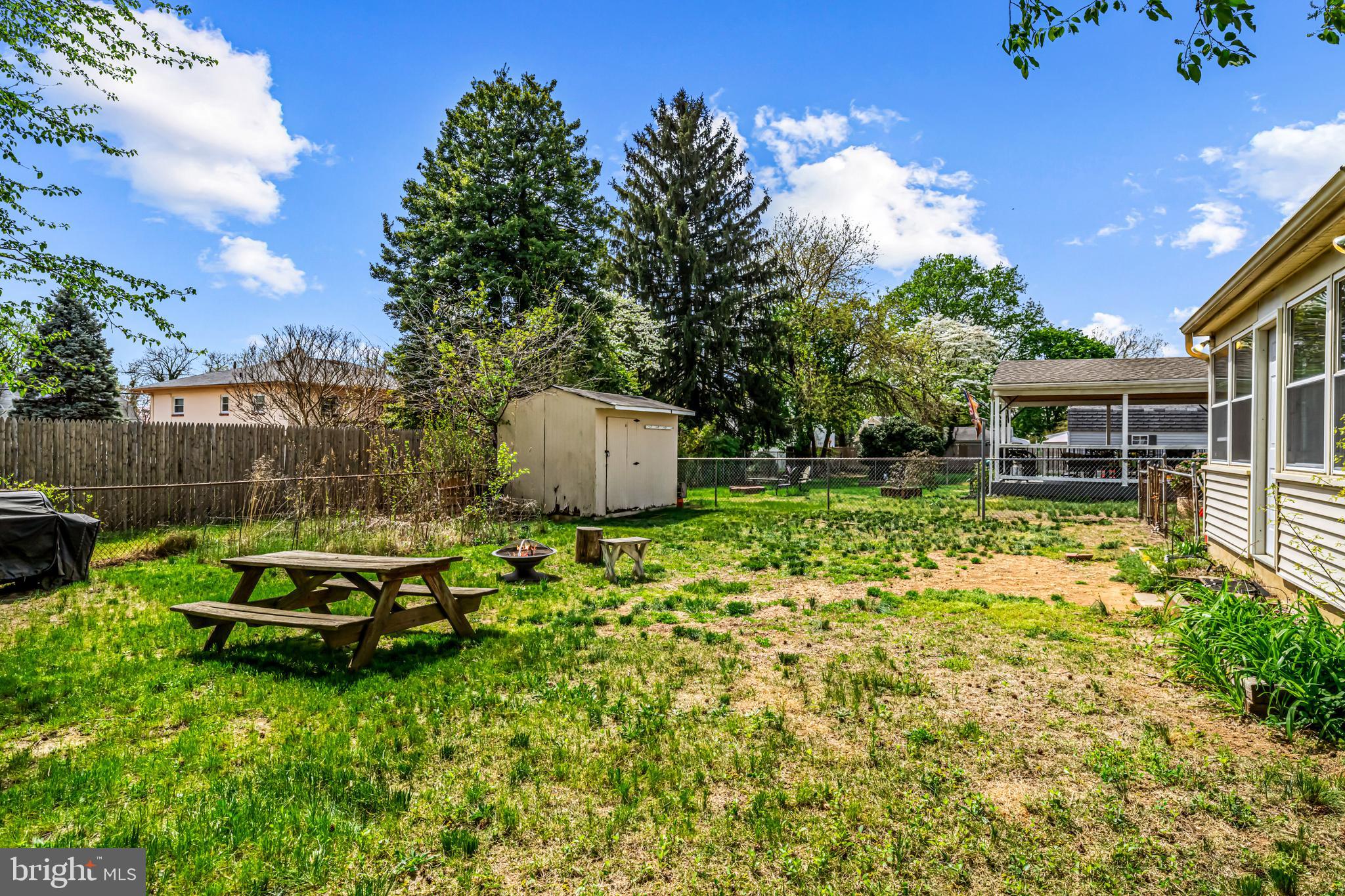 205 Nicholson Road Mount Ephraim, NJ 08059 - Photo 21 of 24 a backyard of a house with a garden and barbeque oven