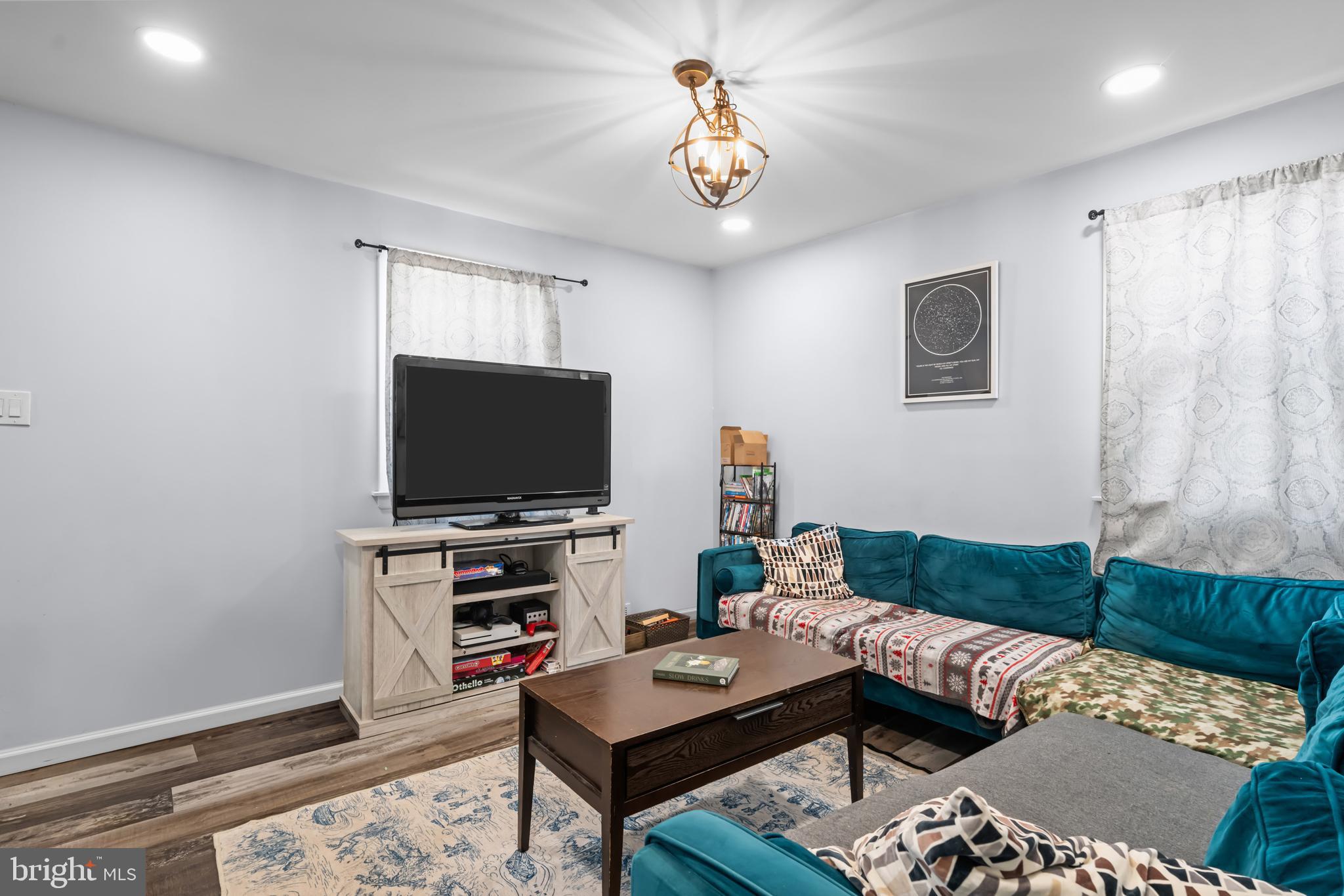 205 Nicholson Road Mount Ephraim, NJ 08059 - Photo 5 of 24 a living room with furniture and a flat screen tv