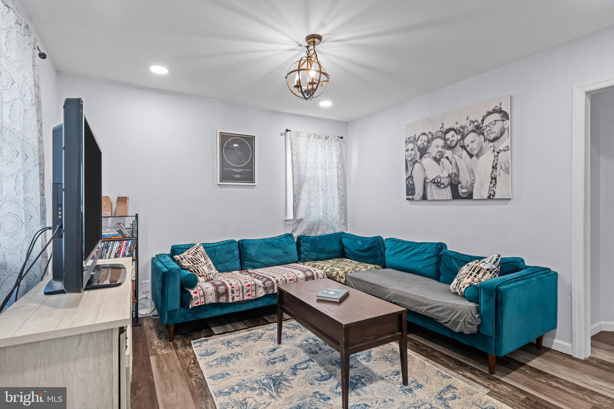 205 Nicholson Road Mount Ephraim, NJ 08059 - Photo 6 of 24 a living room with furniture and a flat screen tv