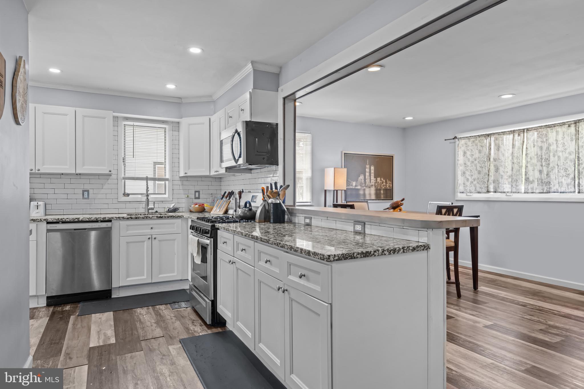 205 Nicholson Road Mount Ephraim, NJ 08059 - Photo 9 of 24 a kitchen with stainless steel appliances granite countertop a sink stove and refrigerator