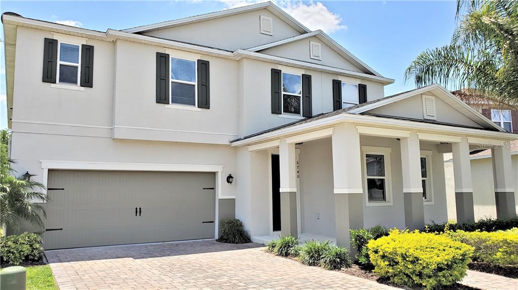 6740 Bridgewater Village Road Windermere, FL 34786 - Photo 1 of 1 a front view of a house with a yard