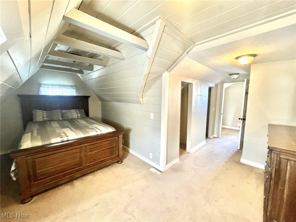 4440 Dryden Court Southwest Canton, OH 44708 - Photo 25 of 28 Bedroom featuring light carpet and vaulted ceiling