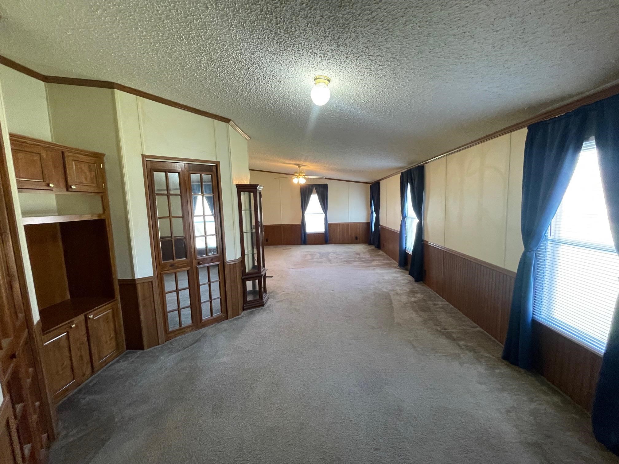 9597 Deadfall Road Brighton, TN 38011 - Photo 11 of 22 a view of a hallway with furniture and a window