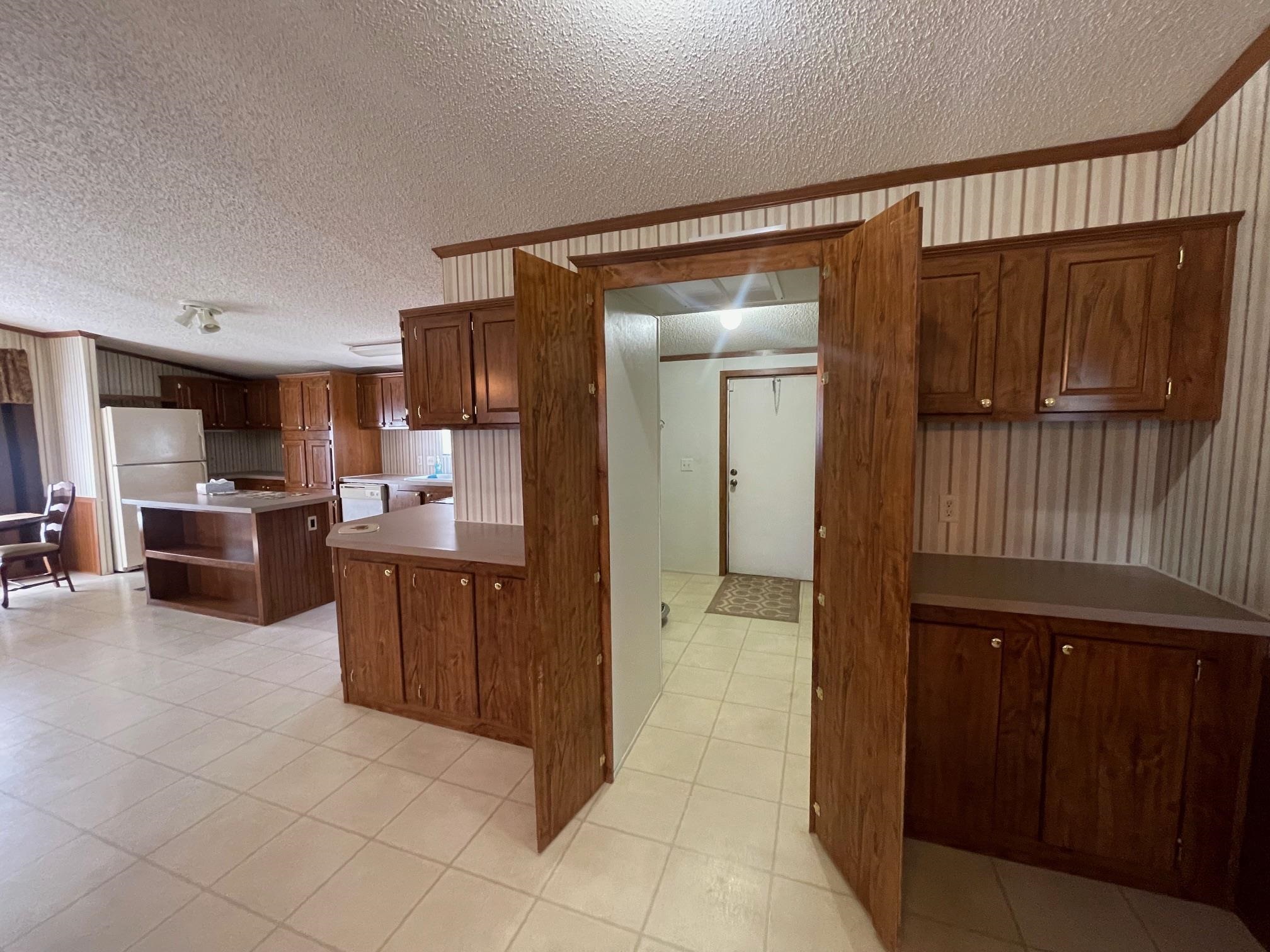 9597 Deadfall Road Brighton, TN 38011 - Photo 2 of 22 a open kitchen with cabinets and stainless steel appliances