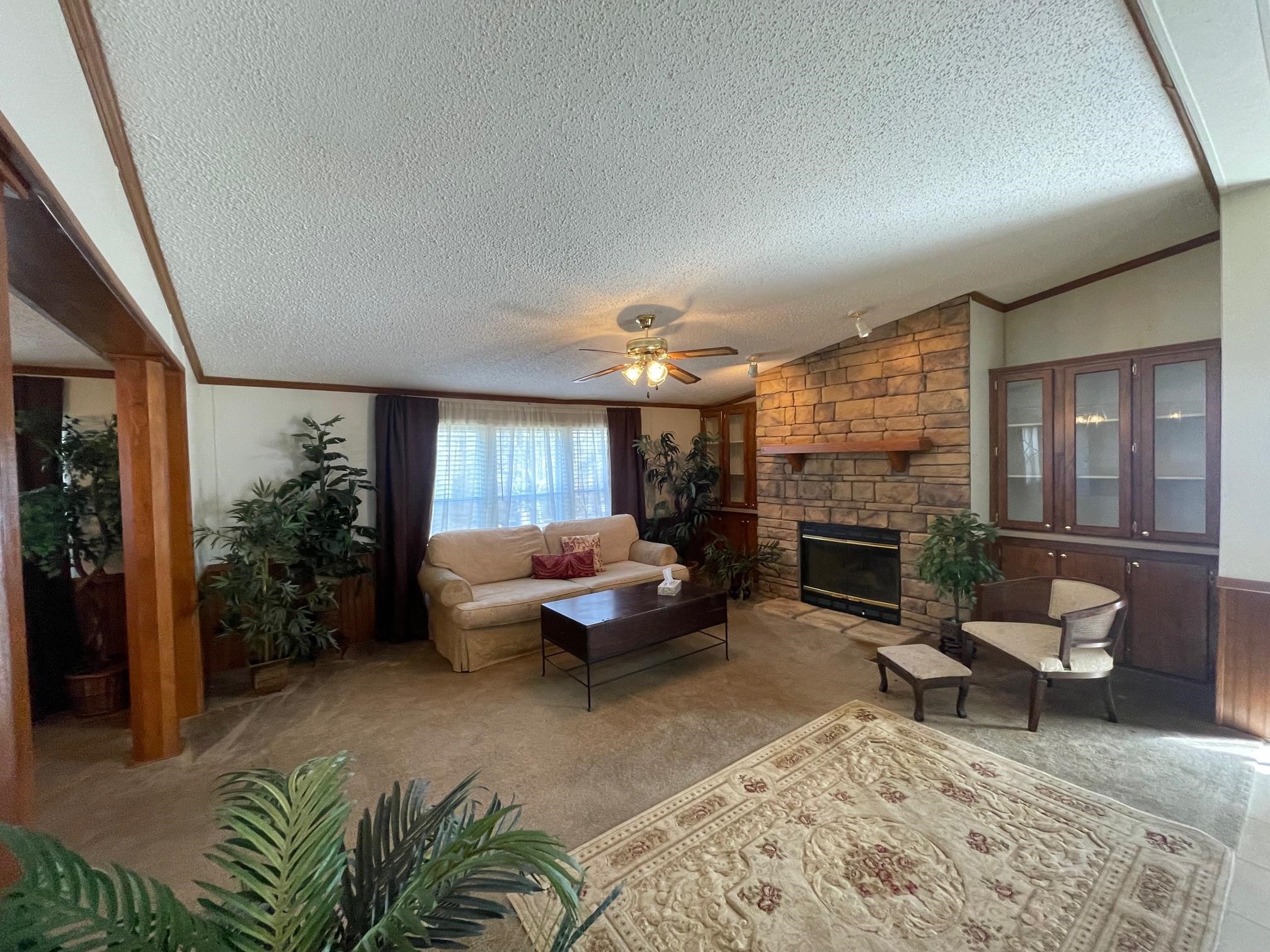 9597 Deadfall Road Brighton, TN 38011 - Photo 4 of 22 a living room with furniture and a fireplace