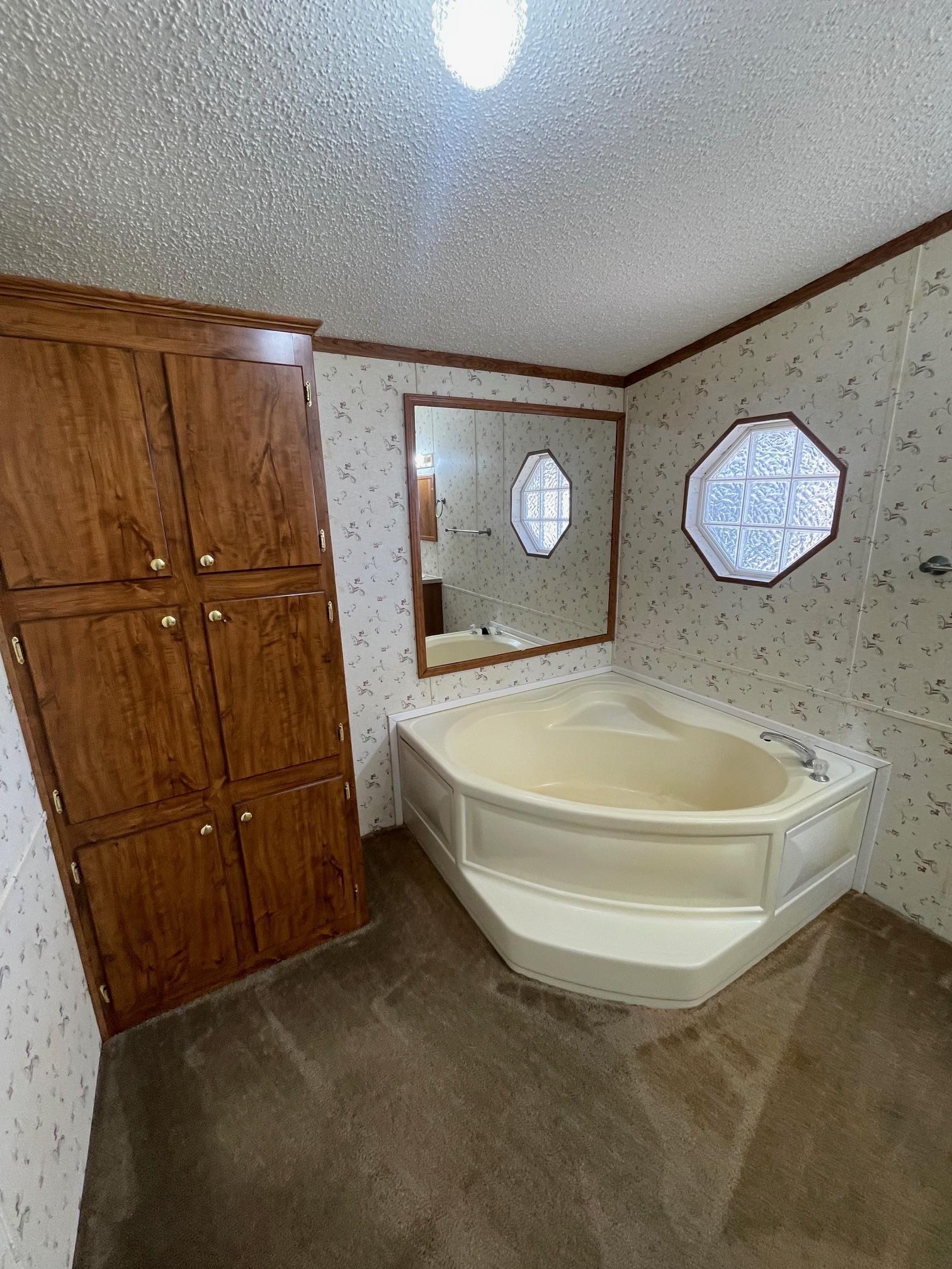 9597 Deadfall Road Brighton, TN 38011 - Photo 10 of 22 a room with a wooden cabinet