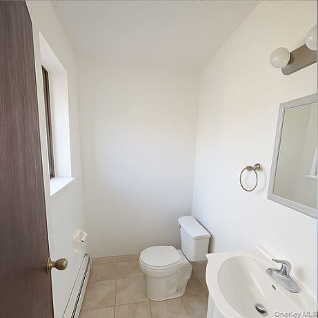 2460 Batchelder Street, Unit 2 Brooklyn, NY 11235 - Photo 12 of 14 a bathroom with a sink and toilet