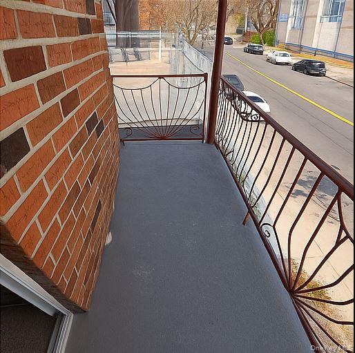 2460 Batchelder Street, Unit 2 Brooklyn, NY 11235 - Photo 13 of 14 a view of stairs and wooden floor