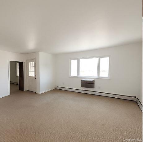 2460 Batchelder Street, Unit 2 Brooklyn, NY 11235 - Photo 6 of 14 an empty room with windows
