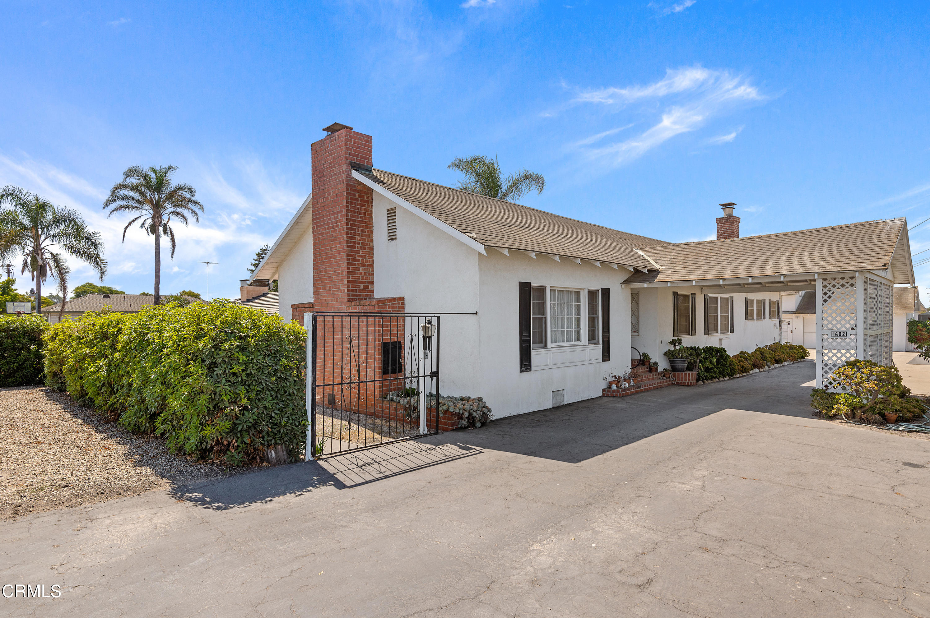 1602 Teal Club Road Oxnard, CA 93030 - Photo 1 of 30 a view of a house with backyard and a tree