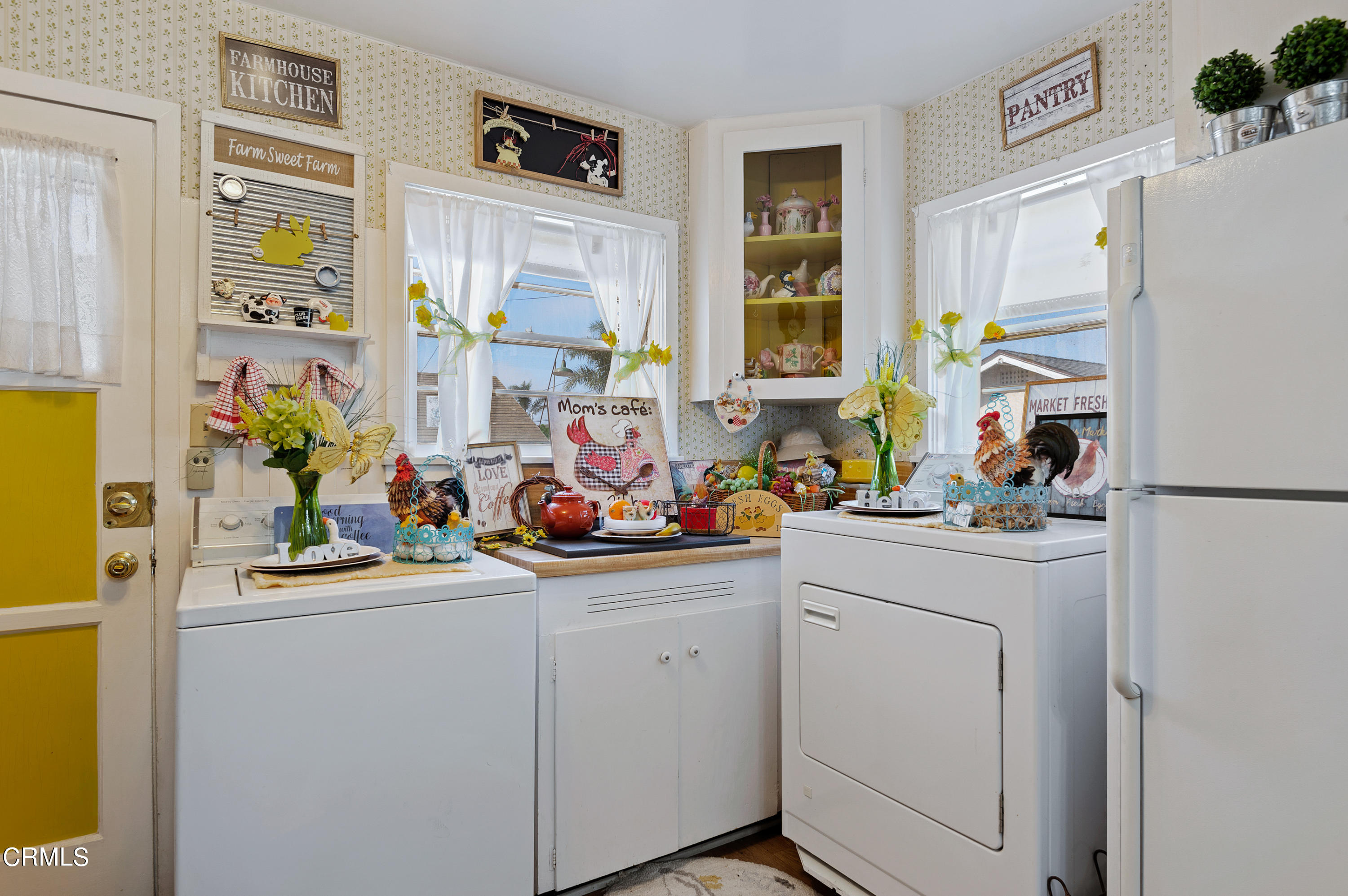 1602 Teal Club Road Oxnard, CA 93030 - Photo 19 of 30 a view of a kitchen with fridge and workspace