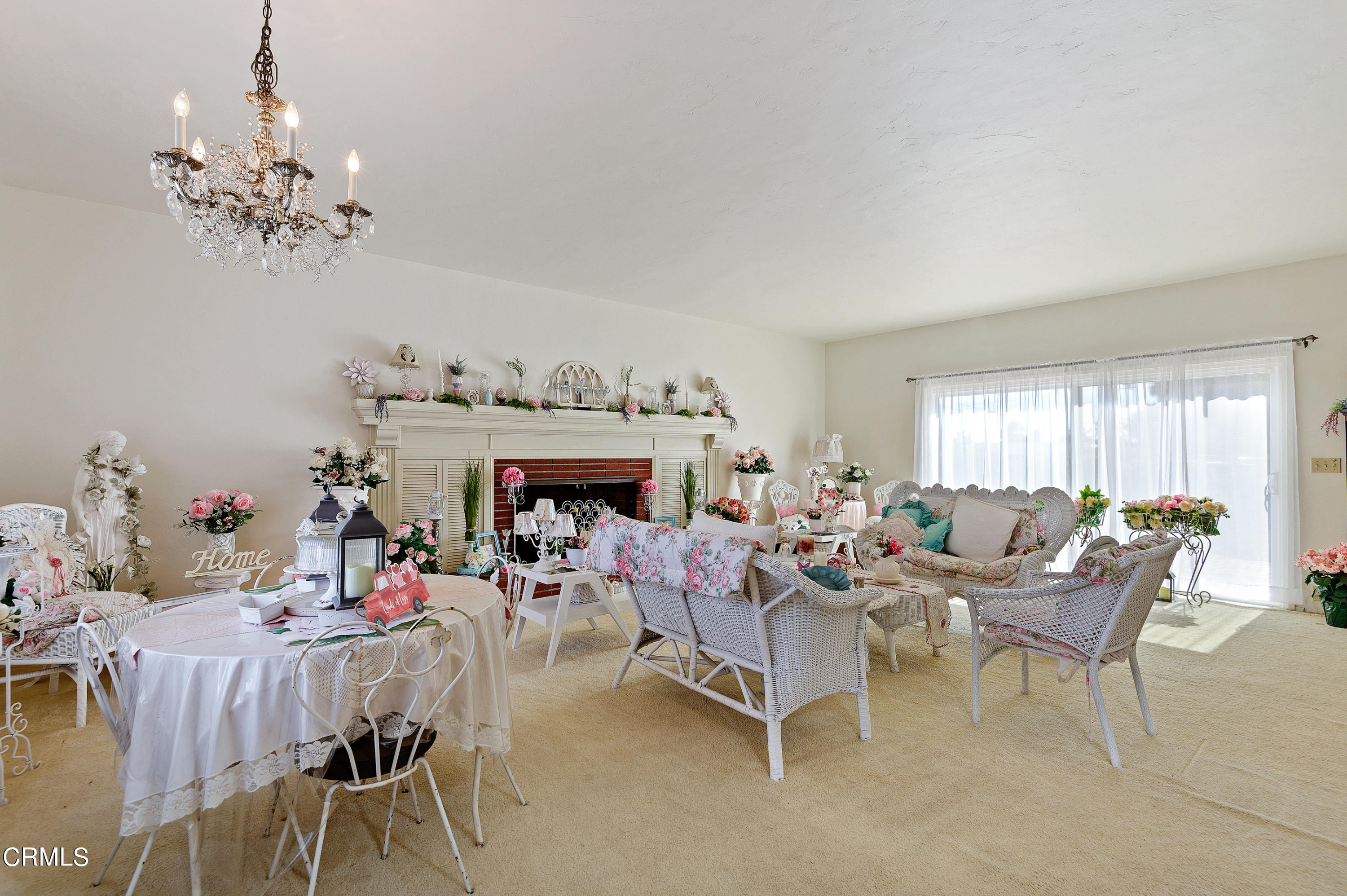 1602 Teal Club Road Oxnard, CA 93030 - Photo 3 of 30 a living room with furniture and a chandelier