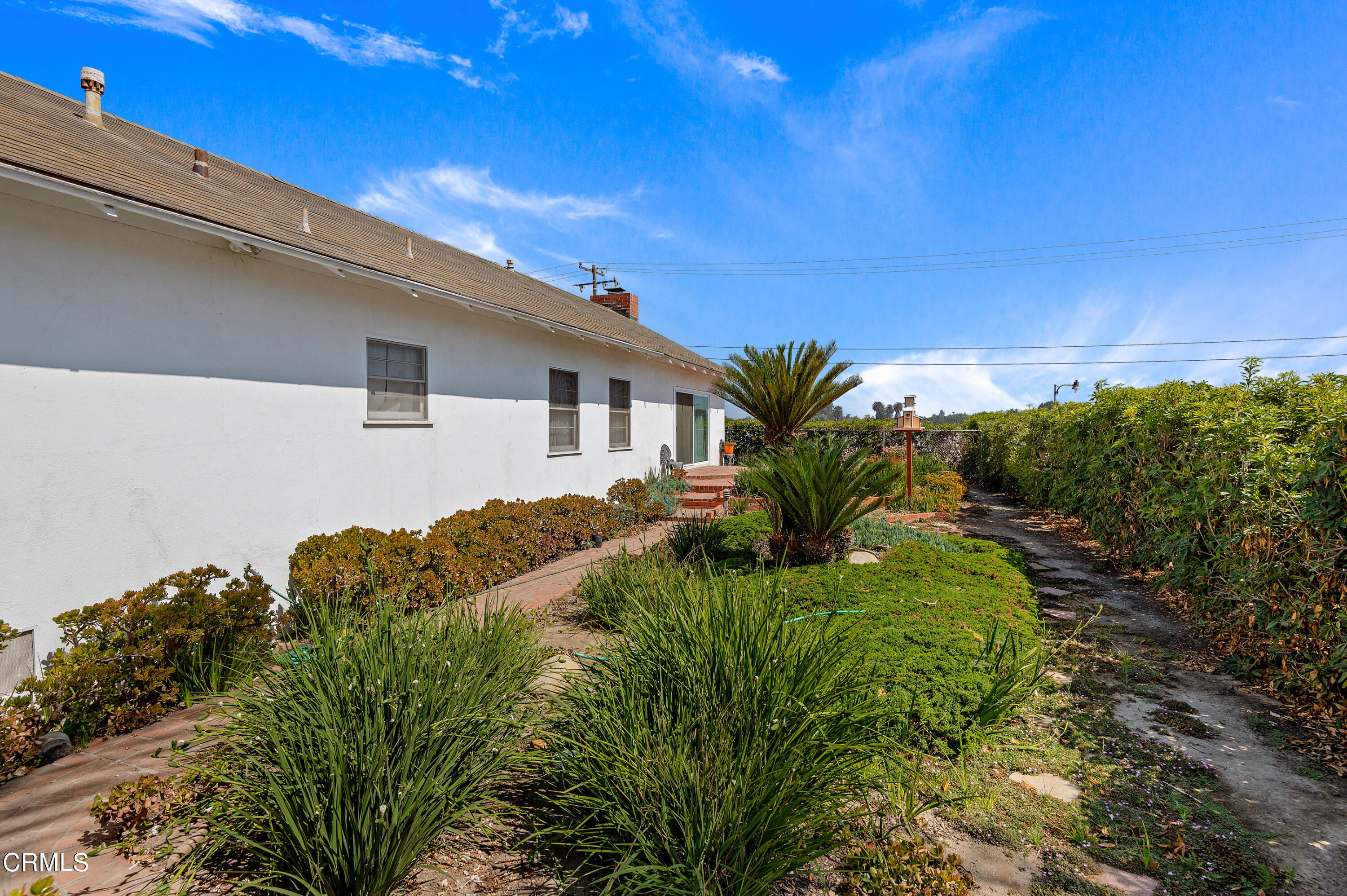 1602 Teal Club Road Oxnard, CA 93030 - Photo 23 of 30 a backyard of a house with lots of green space