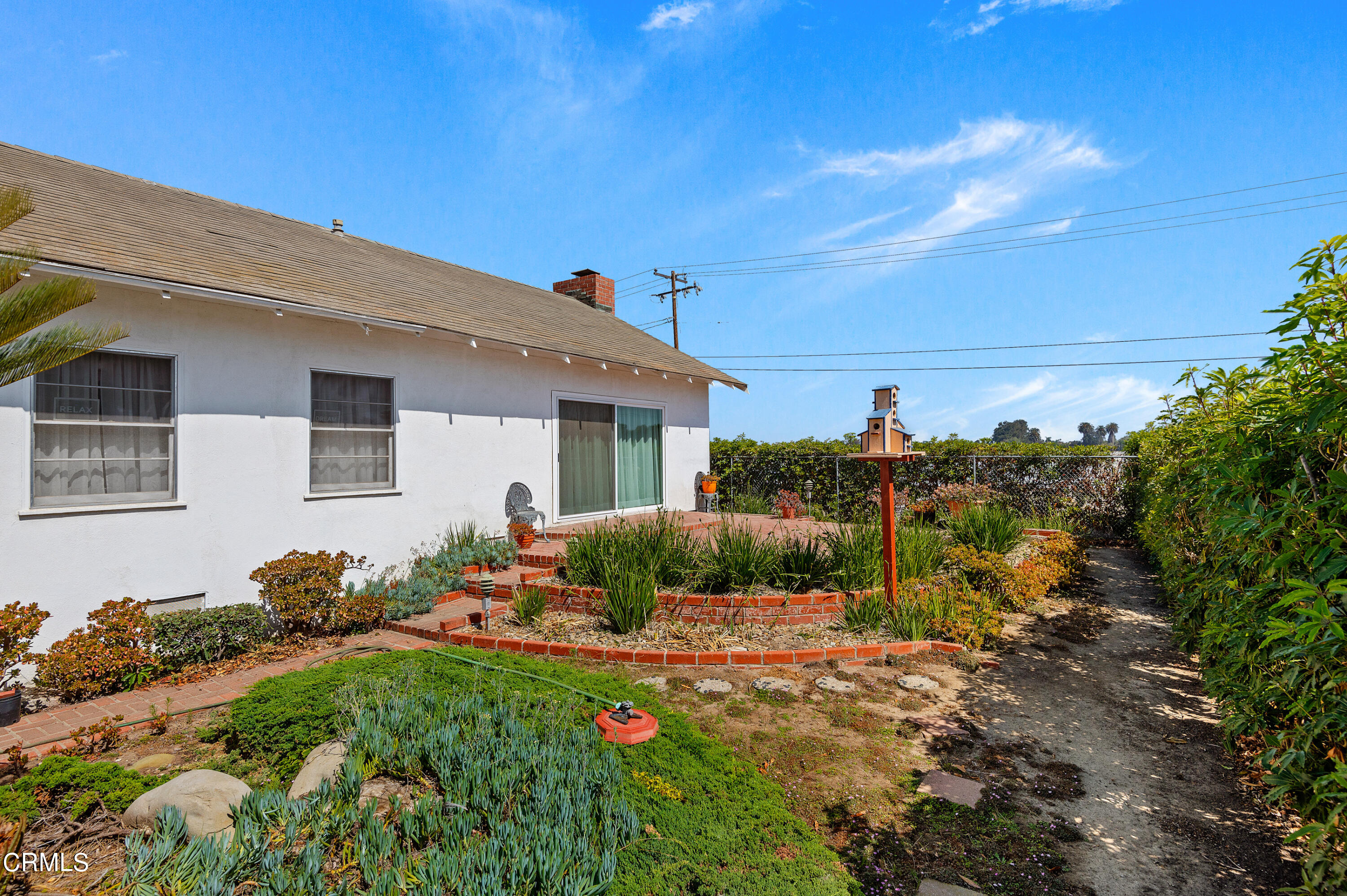 1602 Teal Club Road Oxnard, CA 93030 - Photo 24 of 30 a backyard of a house with table and chairs