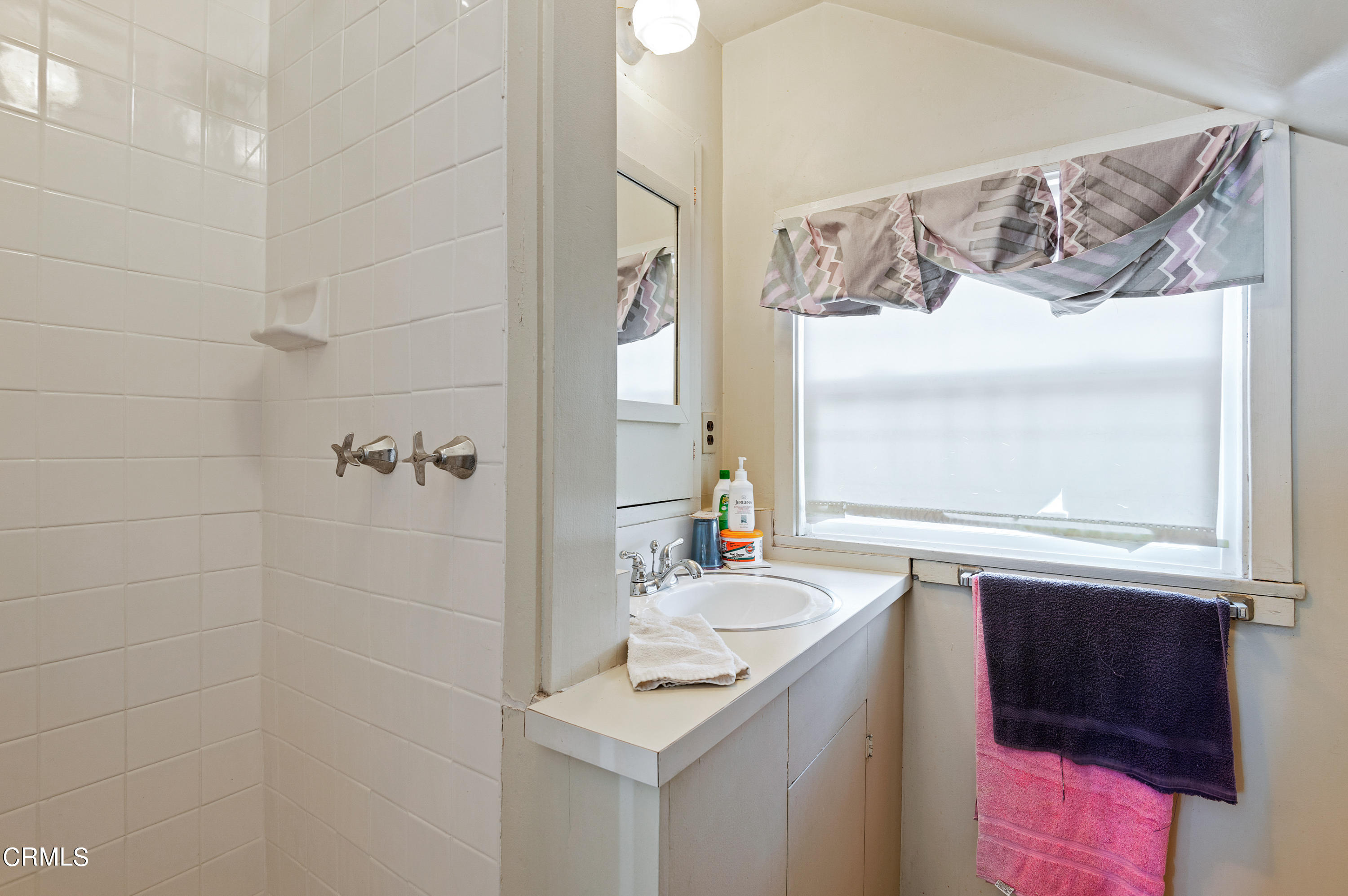 1602 Teal Club Road Oxnard, CA 93030 - Photo 28 of 30 a bathroom with a sink vanity granite and a mirror