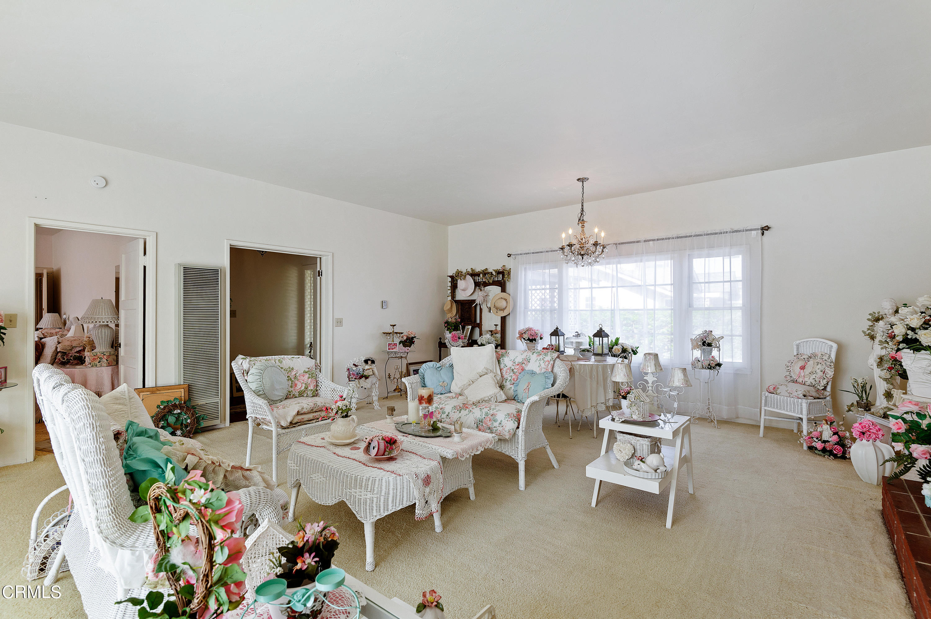 1602 Teal Club Road Oxnard, CA 93030 - Photo 5 of 30 a living room with lots of furniture and a chandelier