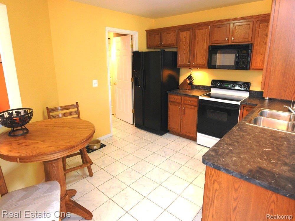 110 Cherry Grove Road, Unit 1 Canton, MI 48188 - Photo 3 of 24 Kitchen view toward laundry room