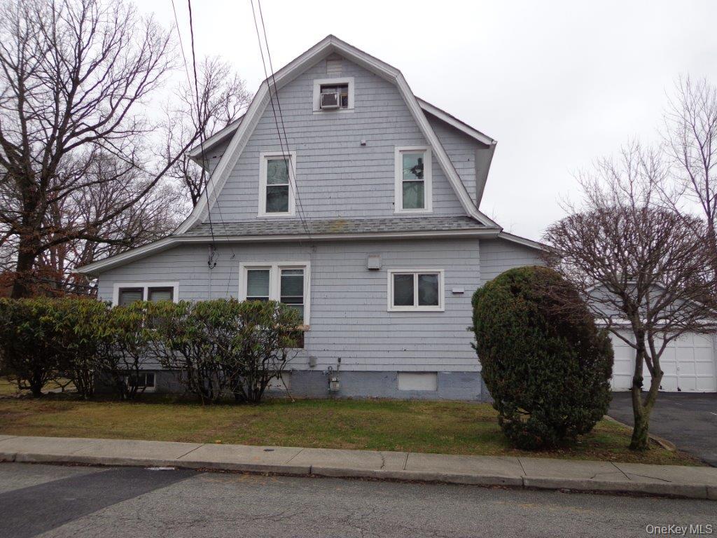 208 Saddle River Road Monsey, NY 10952 - Photo 3 of 4 a view of a house with a yard and potted plants