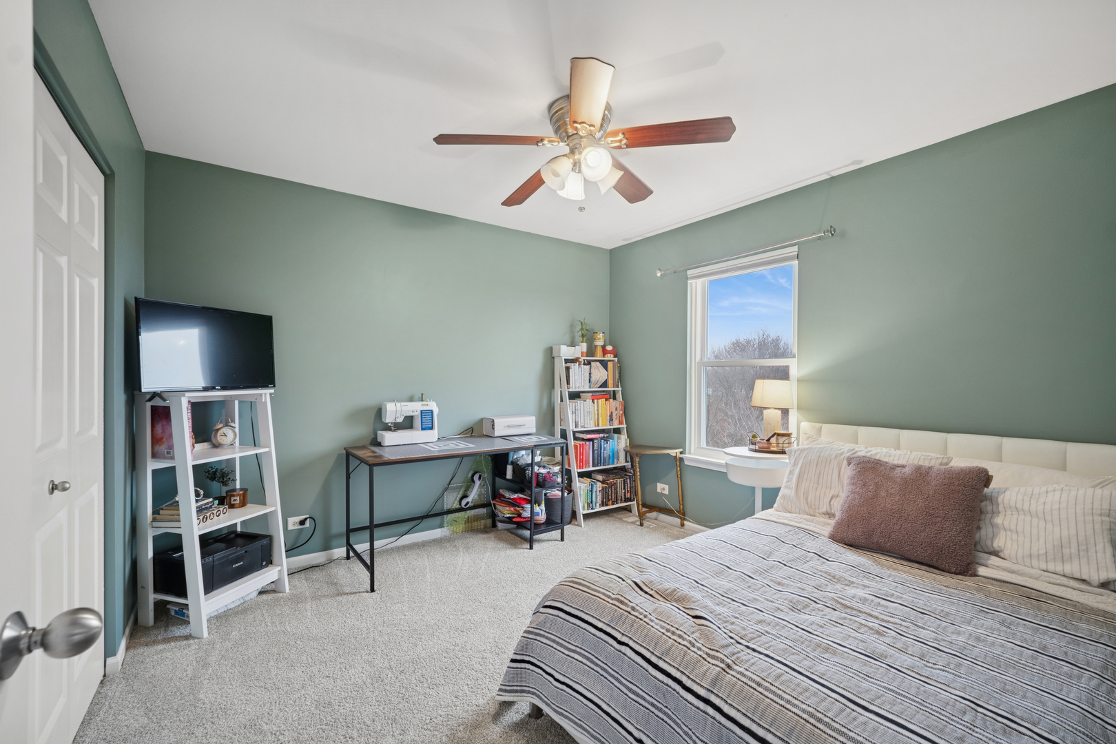 359 Copper Springs Lane Elgin, IL 60124 - Photo 11 of 23 a bedroom with a bed and a book shelf