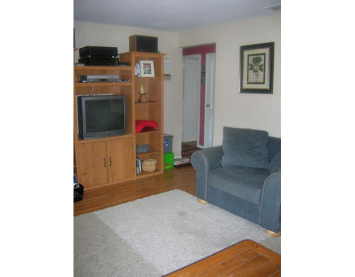 20 Elizabeth Road Billerica, MA 01821 - Photo 7 of 11 a living room with furniture and a flat screen tv