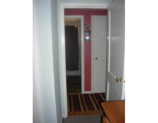 20 Elizabeth Road Billerica, MA 01821 - Photo 9 of 11 a view of a hallway with wooden floor and a bathroom