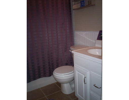 20 Elizabeth Road Billerica, MA 01821 - Photo 10 of 11 a bathroom with a granite countertop toilet and a sink