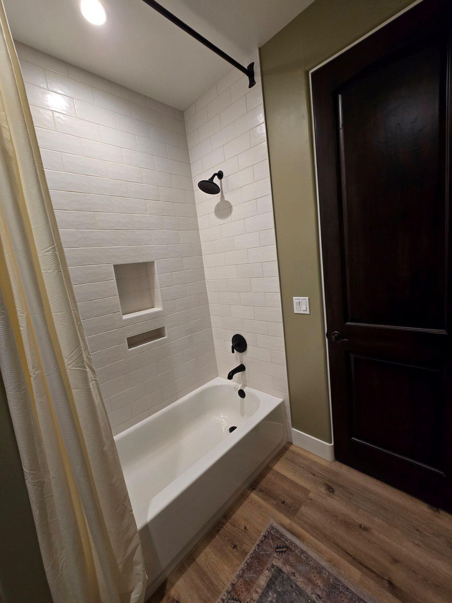 240 Rockinghorse Bend Road Payson, AZ 85541 - Photo 26 of 53 a bathroom with a bathtub and a shower