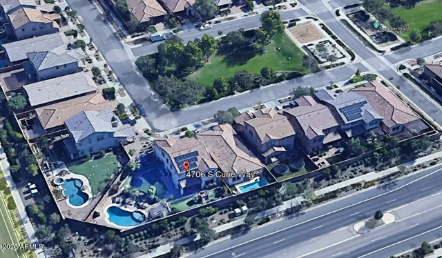 a view of a swimming pool with an outdoor seating