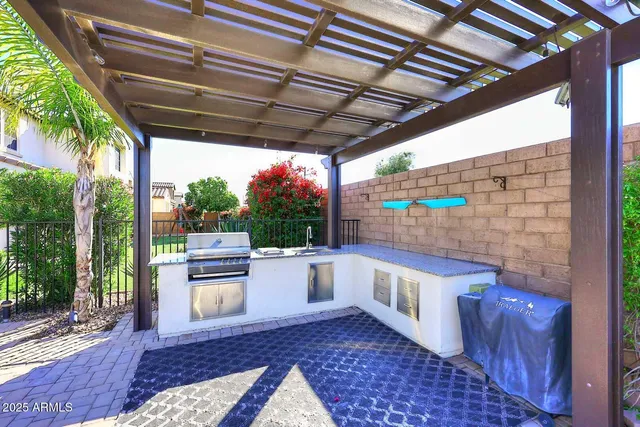 a living room with furniture a flat screen tv and a large window