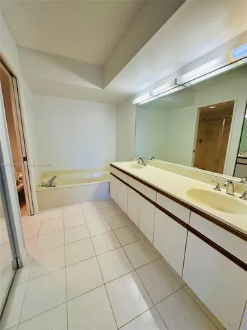 a view of a lake with tall buildings