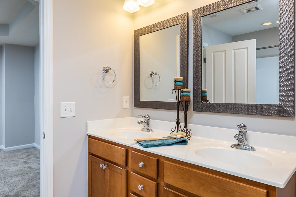 8722 Owl Roost Place Raleigh, NC 27617 - Photo 14 of 26 Fresh and clean with double sinks and plenty of counter space to share! Appointed with updated mirrors add a rich look! Master Bath