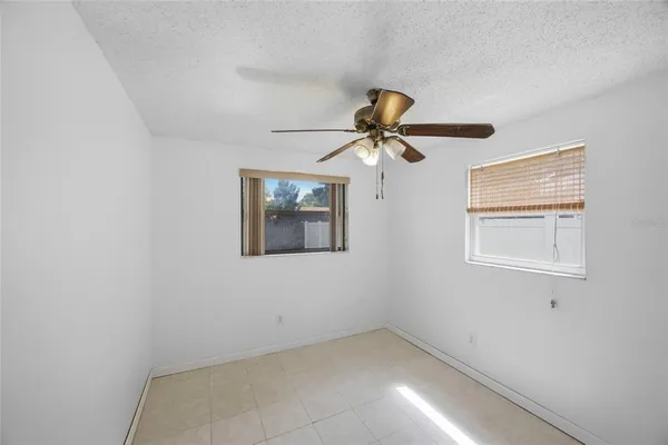 a view of empty room with windows