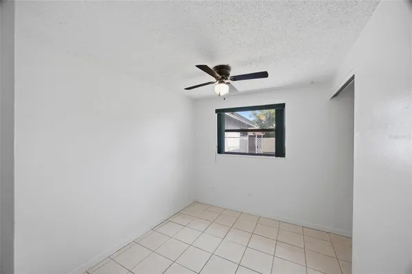 a view of a hallway with a window