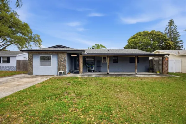 a front view of a house with a garden and porch