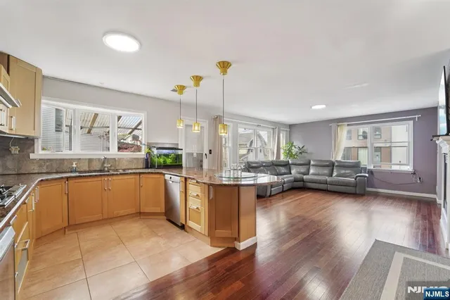 a bedroom with furniture and a wooden floor