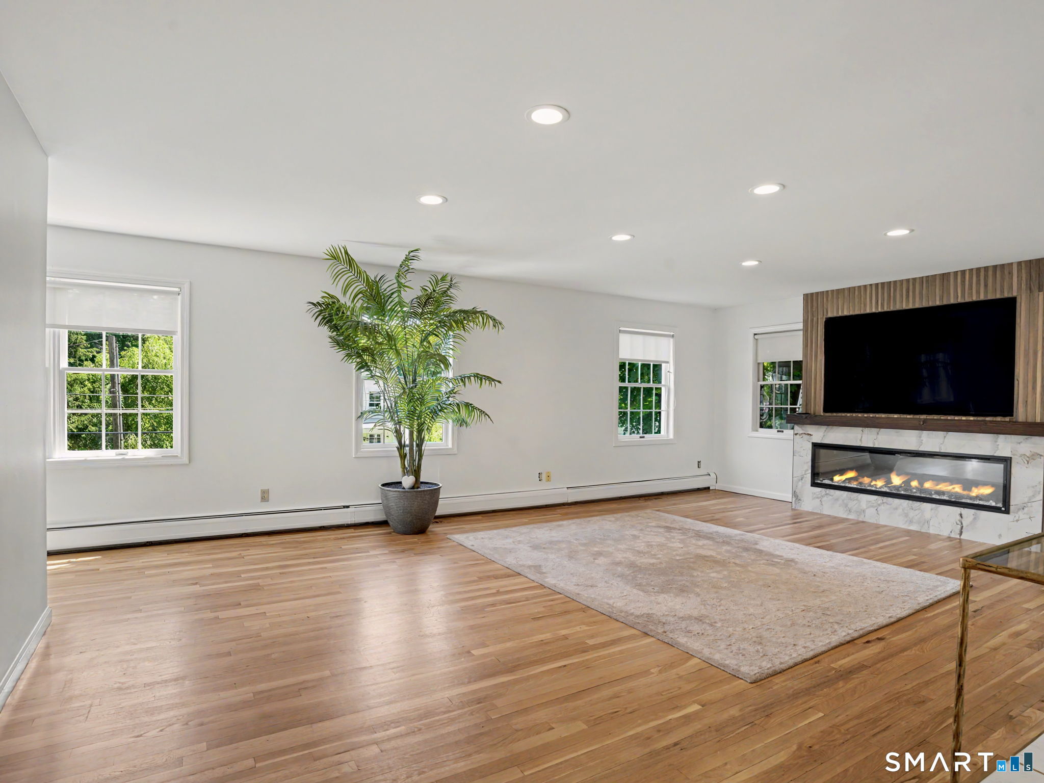 26 Abbott Avenue Ridgefield, CT 06877 - Photo 10 of 40 New stunning fireplace with stone work, mantel and large screen TV included