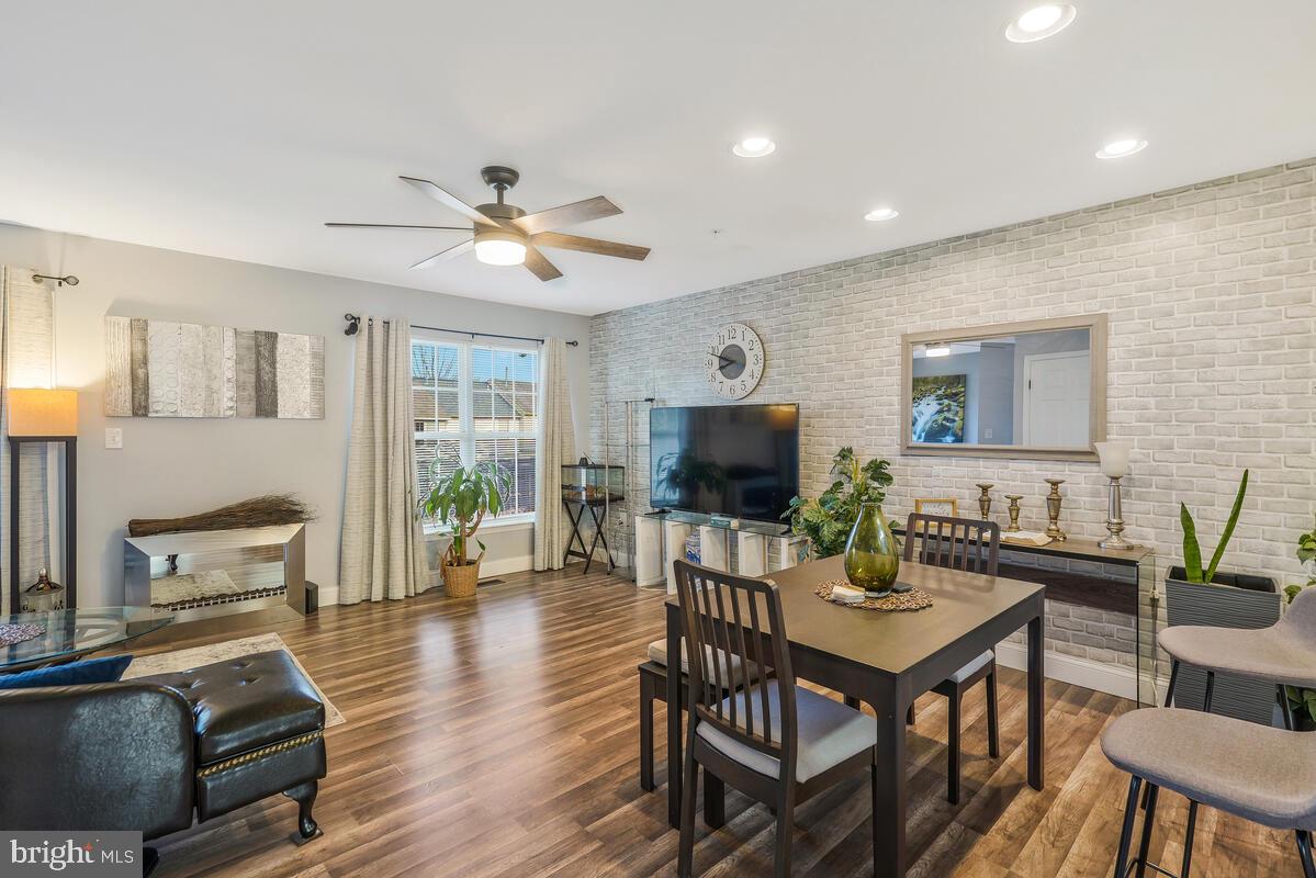 13111 Ripon Place Upper Marlboro, MD 20772 - Photo 11 of 32 a living room with furniture a flat screen tv and a large window