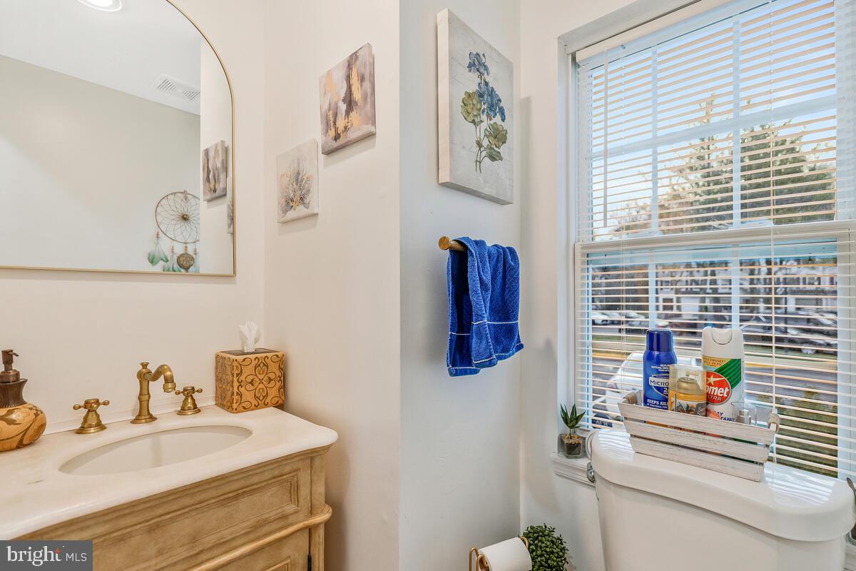 13111 Ripon Place Upper Marlboro, MD 20772 - Photo 24 of 32 a bathroom with a sink and a mirror