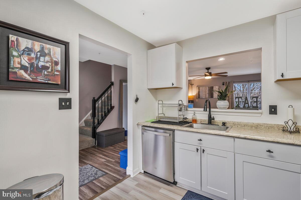 13111 Ripon Place Upper Marlboro, MD 20772 - Photo 6 of 32 a kitchen with a sink cabinets and wooden floor
