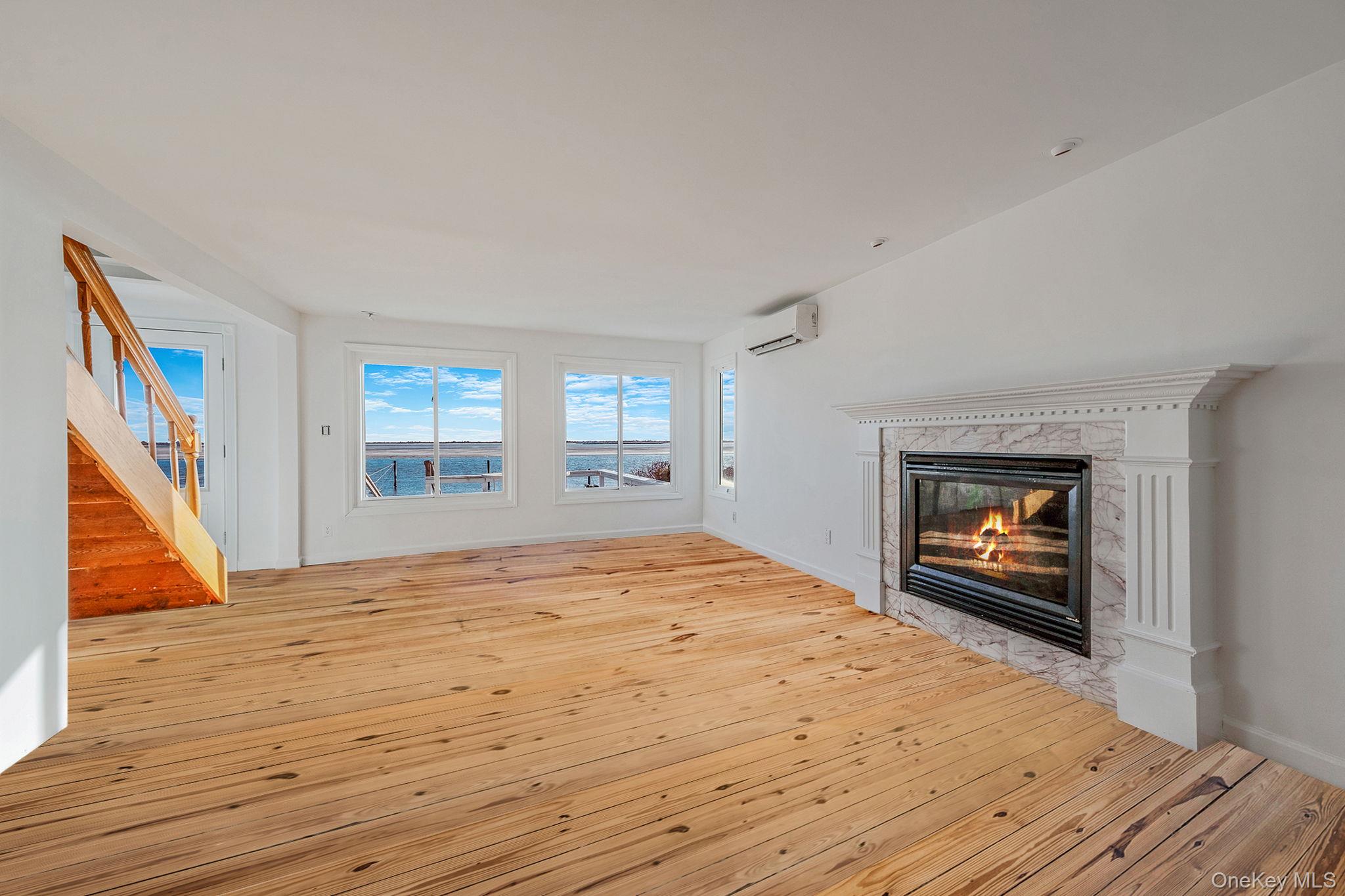 116 Oak Beach Road Babylon, NY 11702 - Photo 16 of 37 a bedroom with a bed and a window