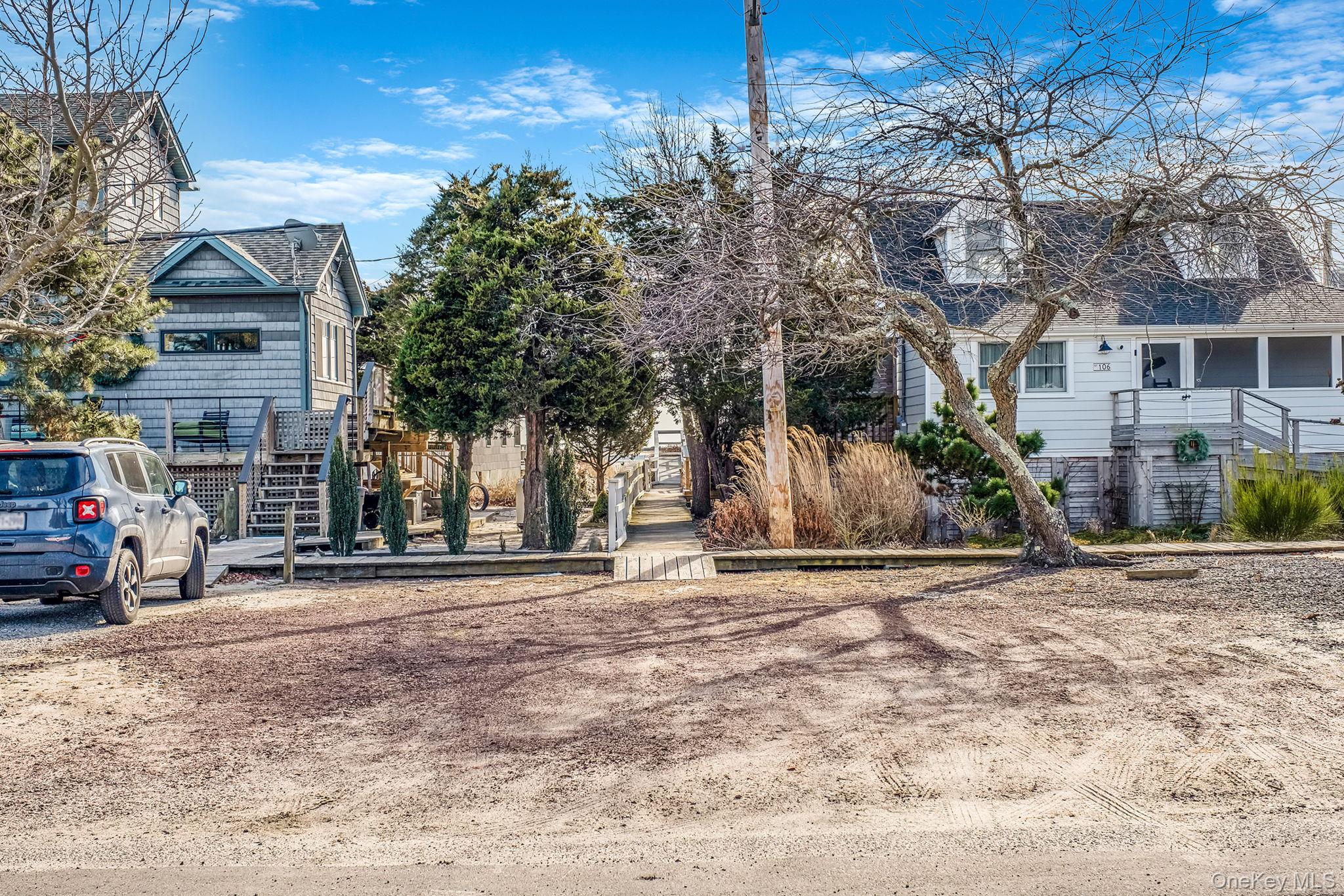 116 Oak Beach Road Babylon, NY 11702 - Photo 28 of 37 a view of a parked cars in front of a building