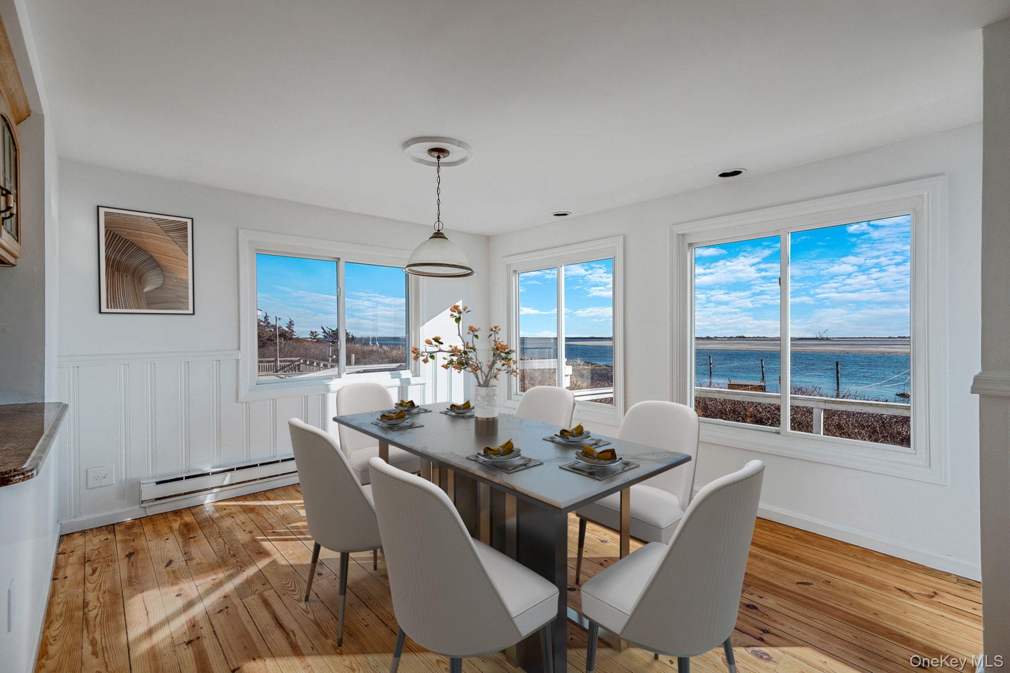 116 Oak Beach Road Babylon, NY 11702 - Photo 7 of 37 a view of a dining room with furniture window and wooden floor